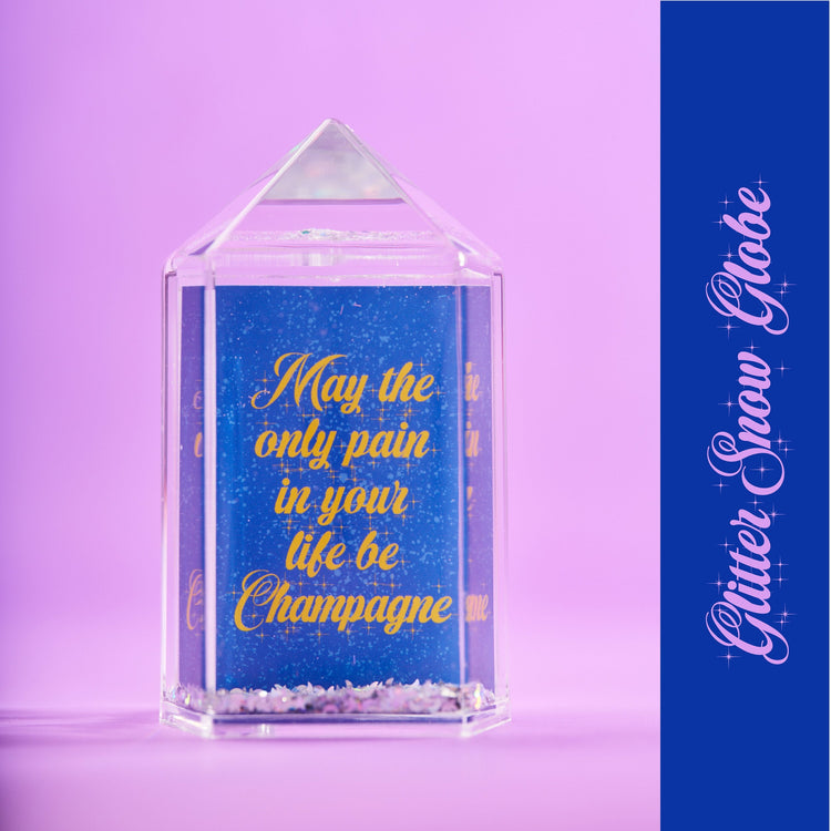 May the only pain in your life be Champagne Snow Globe